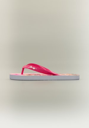 Enkele roze teenslipper met een zool met bloemenpatroon en een wit logo op het bandje, weergegeven van opzij tegen een neutrale achtergrond.
