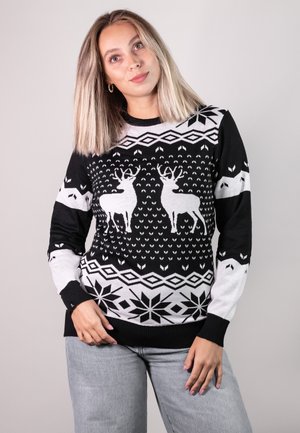 Schwarzer und weißer gestrickter Pullover mit Rentiermotiven, geometrischen Mustern und Schneeflocken. Rippbündchen und Saum; weiche Textur.