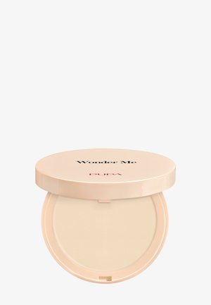 Compact powder in beige case, labeled "Wonder Me" in black and "PUPA" in red. Smooth surface with circular shape and glossy finish.