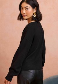 Love & Roses REGULAR FIT - SCATTERED SEQUIN BOW - Pulover - black bow