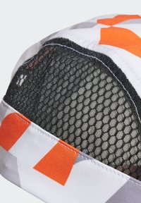 Multicolored cap featuring a white base with orange and gray geometric patterns, black mesh top, and stitched black accents.