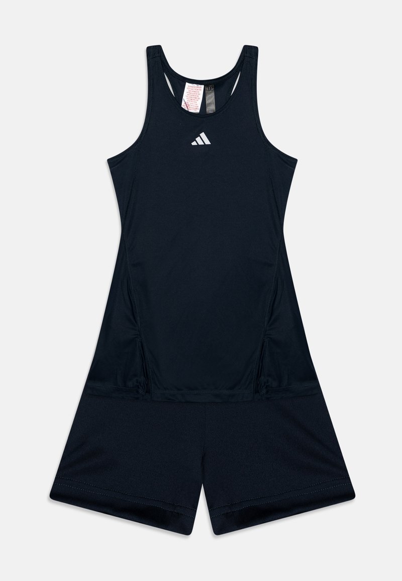 Urheilullinen tummansinisestä kosteutta siirtävästä kankaasta valmistettu romperi, jossa on urheilullinen takaosa, joustava vyötärö ja huomaamaton logo yksityiskohtana rinnassa.