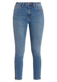 Vaqueros skinny de mezclilla azul con una cintura de altura media, ajustados a lo largo de las piernas y cremalleras en los dobladillos de los tobillos. Textura suave con un desgastado mínimo.