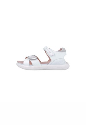 Sandalias de cuero blancas con una plantilla suave de color rosa, correas ajustables y un detalle decorativo plateado en la parte frontal. Suela de goma ligera.