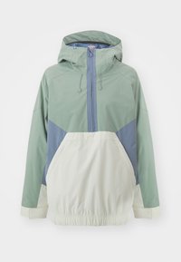 Veste légère à capuche avec un design coloré en vert, bleu et crème, dotée d'une taille élastique et d'une poche avant.