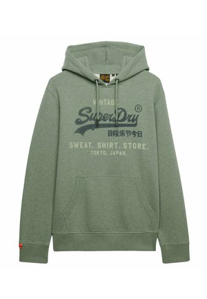 Sudadera con capucha de Superdry verde con bolsillo frontal, cordones y texto impreso que incluye "Vintage Superdry" y "Tokio, Japón".