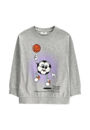 Szara dziecięca bluza z postacią piłki nożnej w stylu kreskówki, która kręci piłkę do koszykówki na palcu oraz z motywującym tekstem sportowym.