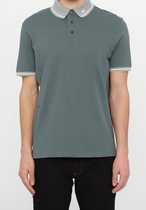 Short-sleeve polo shirt in muted green, featuring a contrasting striped collar and cuffs, three-button placket, and soft texture.