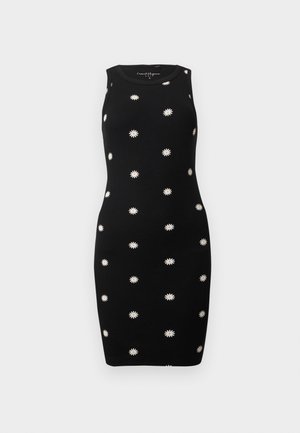 Svart ermeløs tettsittende kjole med hvitt tusenfryd-mønster jevnt fordelt over stoffet.