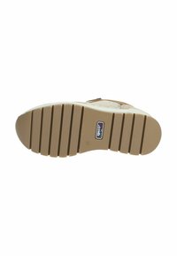 Suela de un zapato; material de goma, color marrón claro, con un patrón texturizado y estriado. Presenta un logo con el texto "Igloo Mini" cerca del talón.