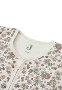 Katoenen bodysuit met bloemmotief en een crèmekleurige achtergrond, voorzien van roze, groene en bruine bloemen, een ronde kraag en een rits aan de voorkant.