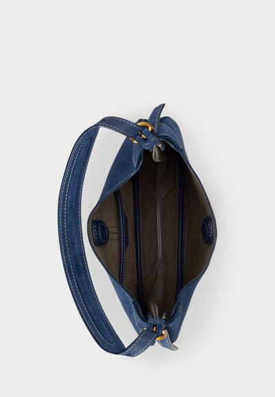 Blue suede handbag with a soft texture, a single shoulder strap, gold hardware accents, and a spacious interior featuring multiple compartments.