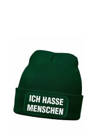 Green knitted beanie with a turned-up cuff and a rectangular patch displaying the text "ICH HASSE MENSCHEN" in white bold font.