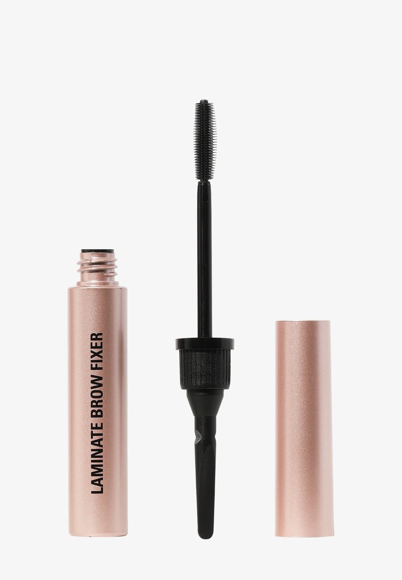Różowo-złota tubka oznaczona "Laminowany żel do brwi" z czarną, wydłużoną szczoteczką do tuszu obok. Gładkie metaliczne wykończenie, cylindryczny kształt.