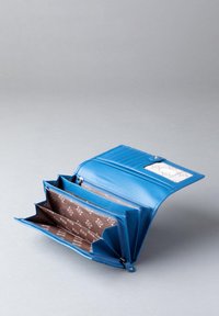 Blue leather wallet with a zippered compartment, three inner sections, and a clear ID slot, featuring a patterned brown textile lining.