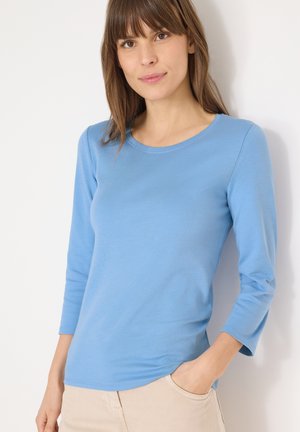 - Bluzka z długim rękawem