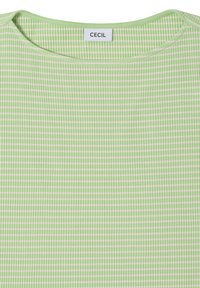 Jasnozielony prążkowany top z białymi paskami. Posiada okrągły dekolt oraz metkę z napisem "CECIL" przy szyi. Wykonany z miękkiego materiału tekstylnego.