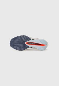 White and gray running shoe sole with a textured dark blue tread. Features a red stripe and text reading "FLYPLATE" on a light blue section.