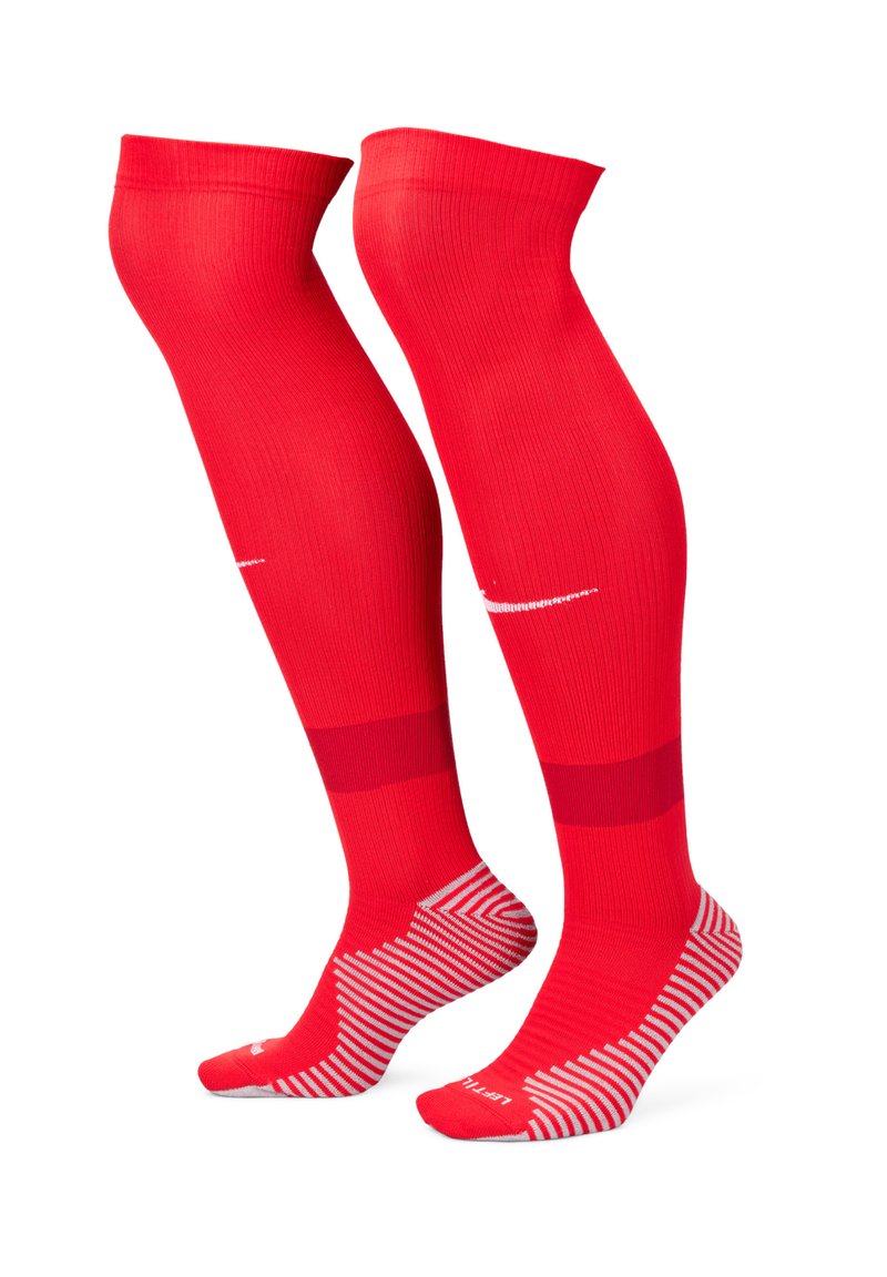 Calze rosse al ginocchio con una texture a coste, caratterizzate da un colore uniforme con un logo a contrasto e un design a strisce sulla parte del piede.