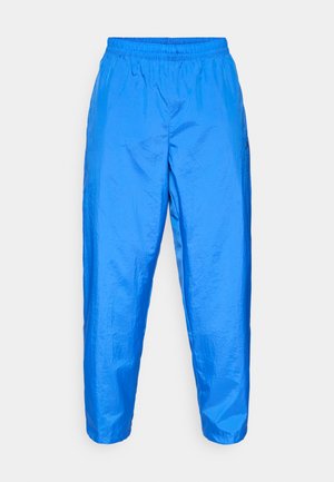 Calças leves e brilhantes de cor azul, com um cós elástico e pernas ajustadas, apresentando uma textura suave e sem bolsos ou padrões visíveis.