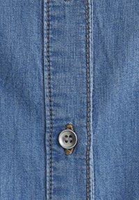 Denim shirt with a light blue fabric, featuring a vertical button placket and a circular gray button with four holes. Smooth texture.