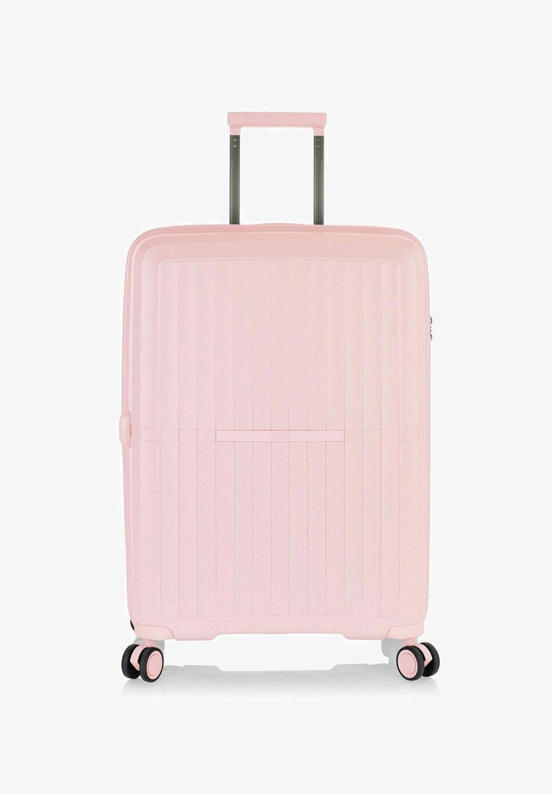 Hartschalenkoffer in sanftem Pink, mit vertikaler Rillenstruktur, ausziehbarem Griff und vier multidirektionalen Rollen für eine einfache Handhabung.