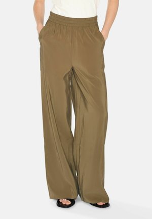 Olive green, wide-leg pants made of smooth, lightweight fabric. Features an elastic waistband and side pockets. Flat front design.