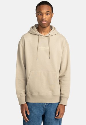 Felpa beige con cappuccio, dotata di tasca frontale, cordini e un logo discreto. Tessuto morbido con vestibilità comoda e polsini a coste.