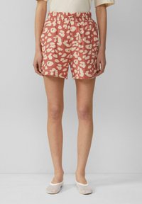 Rosa Shorts mit einem gemusterten Design, das off-white abstrakte Formen zeigt. Elastischer Bund mit einem Kordelzug-Detail, gefertigt aus leichtem Stoff.