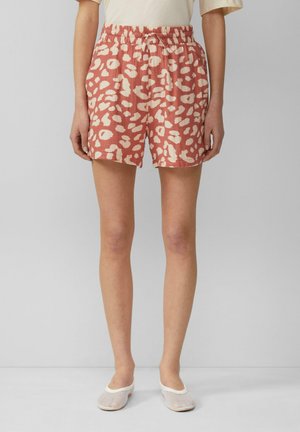Roze shorts met een patroonontwerp dat off-white abstracte vormen weergeeft. Elastische tailleband met een trekkoorddetail, gemaakt van lichtgewicht stof.
