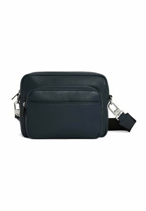 Leather messenger bag in dark navy, featuring a front zip pocket and adjustable strap. Textured surface with silver-tone hardware accents.