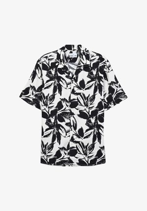 Camicia a maniche corte in morbido tessuto con un motivo floreale nero su sfondo bianco; presenta un colletto a petto di pollo e chiusura a bottone.