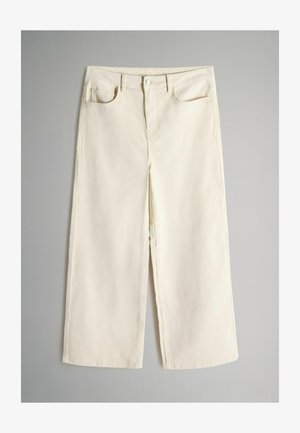 Krämfärgade vida jeans med hög midja, med fem fickor och framknäppning. Tillverkade av denim med en slät yta.