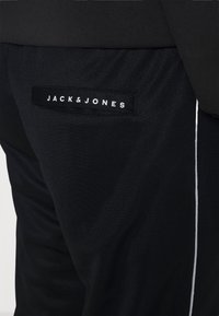 Jack & Jones JJIWILL JJSPRING  - Calças de fato de treino - black