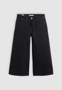 Svarte vide bukser laget av denim. Har høy midje, frontlommer og detalj med snor. Rent, uten pynt design.