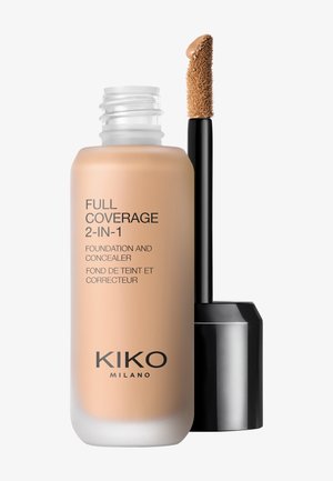 Flacon de fond de teint et correcteur 2 en 1 à couverture complète avec applicateur, montrant du maquillage liquide beige sur la pointe.