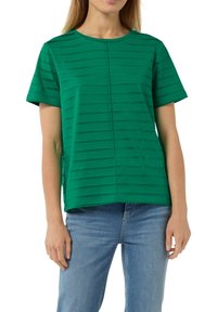Green short-sleeve t-shirt featuring horizontal stripes, round neckline, and a straight cut. Material appears soft with a smooth texture.