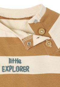 Brown and cream striped shirt with a round neck, featuring two buttons and the text "little EXPLORER" in blue at the chest. Cotton material.