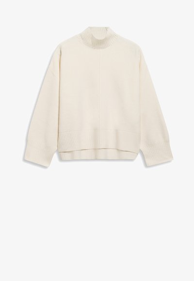 Grietos spalvos megztinis su raukšlėtu apykakle, nuleistais pečiais ir šiek tiek trumpu siluetu. Pagamintas iš minkštos, tekstūruotos medžiagos.