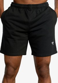Black cotton shorts with an elastic waistband, side pockets, and subtle logo detail on the lower hem. Smooth texture and casual fit.