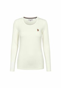 Witte langwerpige shirt met lange mouwen in ribbelstof met een ronde halslijn en geborduurd ontwerp op de linkerborst. Bevat subtiele kleuraccenten op de kraag.