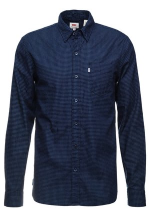 Marineblauw overhemd met lange mouwen, klein geruit patroon en een borstzakje, Levi's logo-label op het zakje.
