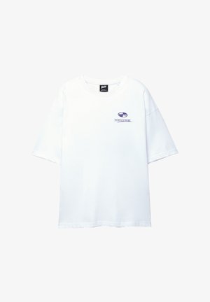 White cotton t-shirt with short sleeves, a round neckline, and a small purple logo on the front. Features a relaxed, boxy fit.