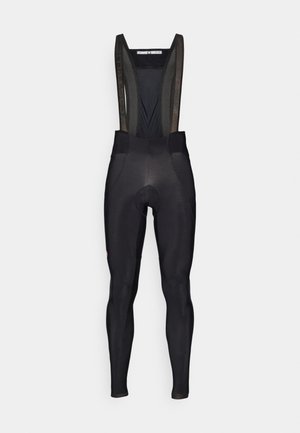Black cycling bib shorts with a mesh back, padded seat area, and ergonomic design. Features a logo near the thigh and smooth texture.