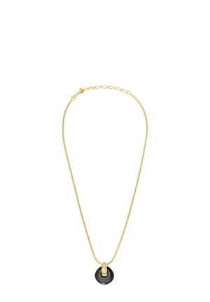 Collier en chaîne dorée avec un pendentif circulaire noir, accentué d'un élément métallique au centre. Le design est épuré et minimaliste.