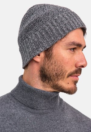 Gray knitted beanie with ribbed texture, soft material, featuring a folded cuff edge. Worn on the head with a subtle sheen.