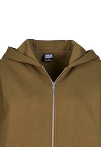 Olivgrüner Zip-Hoodie mit Kapuze, ausgestattet mit einem silbernen Reißverschluss und einem "URBAN CLASSICS"-Label. Weicher Stoff und minimalistisches Design.
