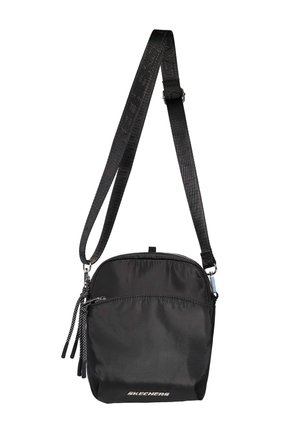 Sac bandoulière compact noir avec sangle texturée réglable, poche zippée à l'avant et logo "Skechers" en bas au centre devant.