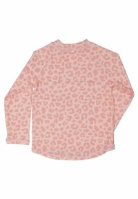Långärmad topp i ljusrosa med texturerat, subtilt leopardmönster. Har rundad nederkant och raglanärmar för en avslappnad passform.