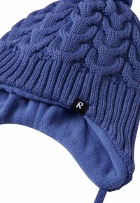 Knitted blue hat with a cable pattern, featuring a fleece lining and ear flaps. Includes a small black logo label on the side.